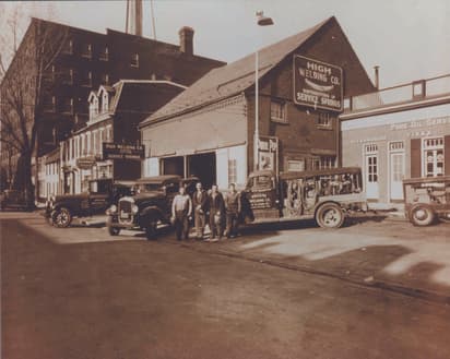 High Welding Company in 1931, Sanford and three co-workers with trucks in front of the welding shop on Lemon Street in Lancaster Pa