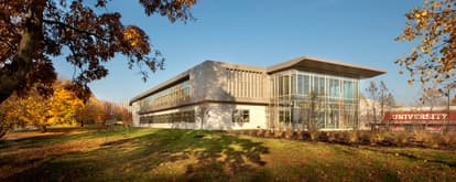 an education building with large windows made of precast concrete