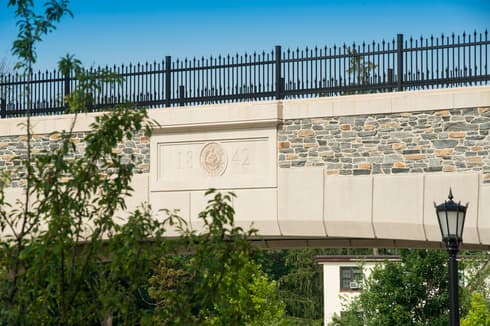 1842 and Villanova Seal on Pedestrian Bridge in concrete
