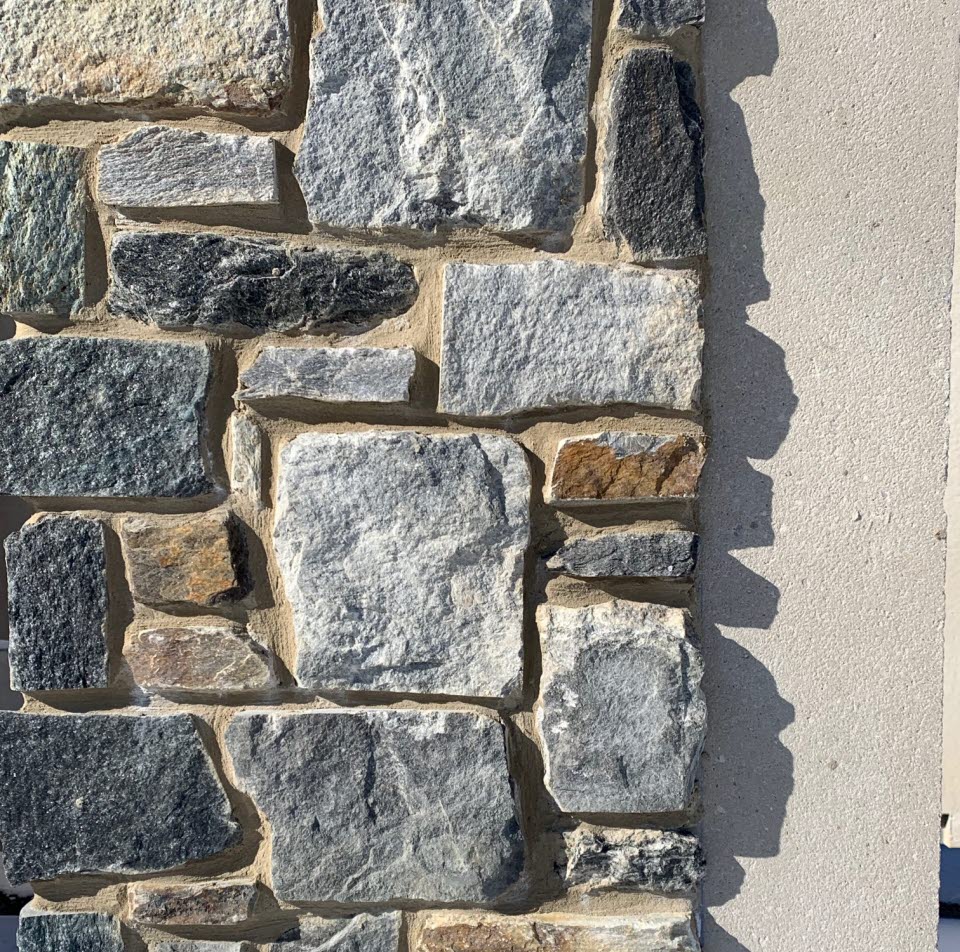 Stone applied to precast at plant prior to being transported to site
