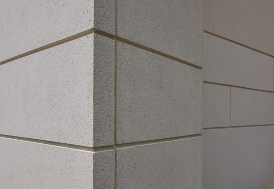 Corner edge of building with reveals and simple sandblast finish