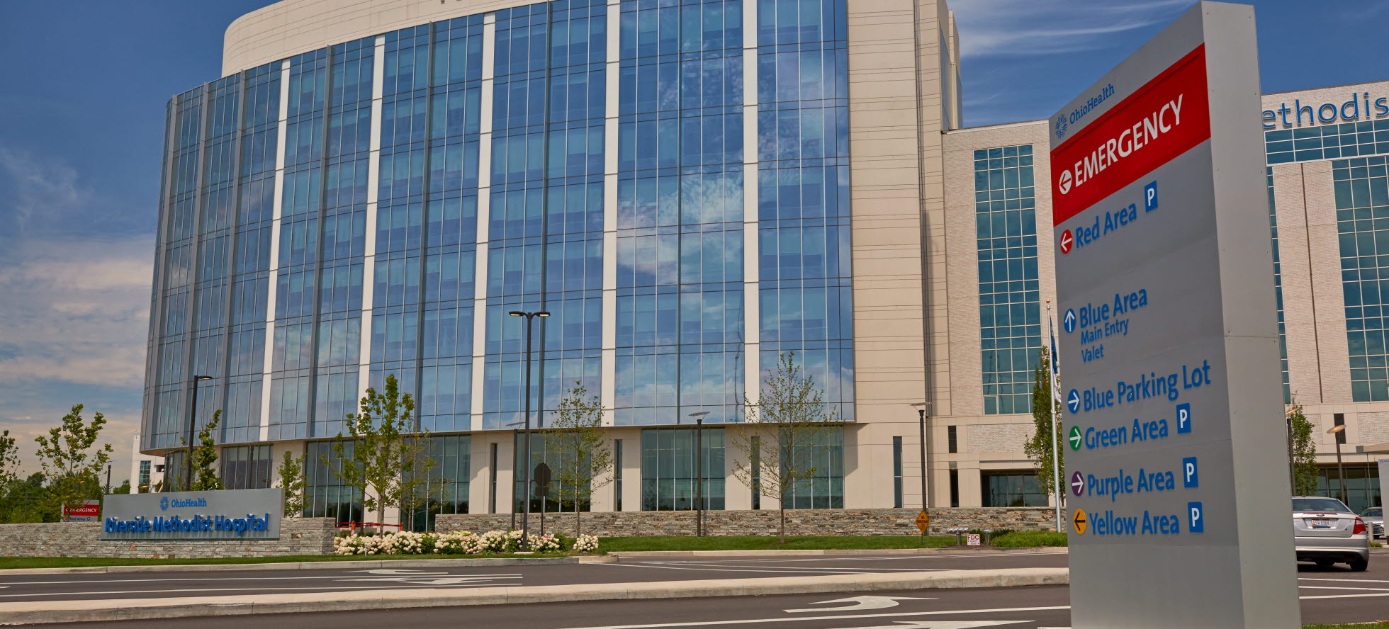 Front View of Riverside Neuroscience Center with Parking Sign