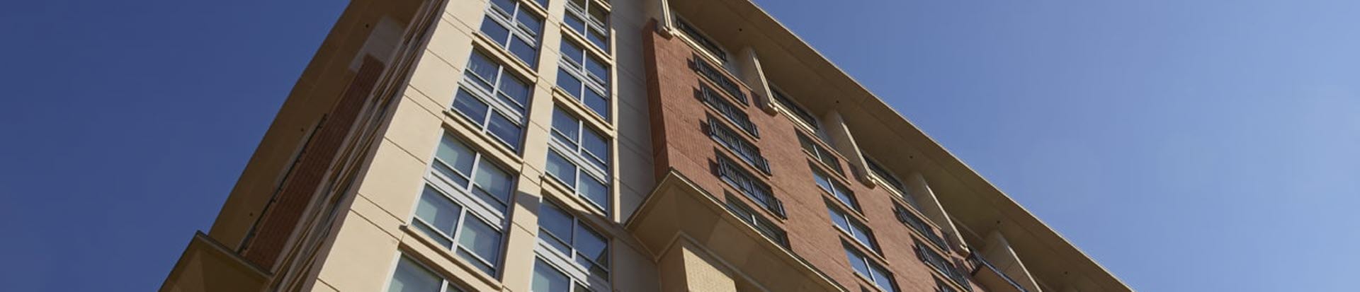 tan and brick precast concrete building